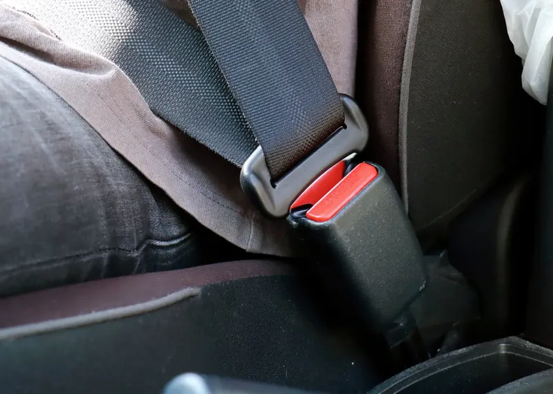 Fastened seat belt with the buckle engaged