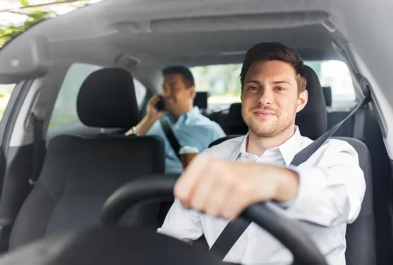 Driver and passenger travelling with belts fastened